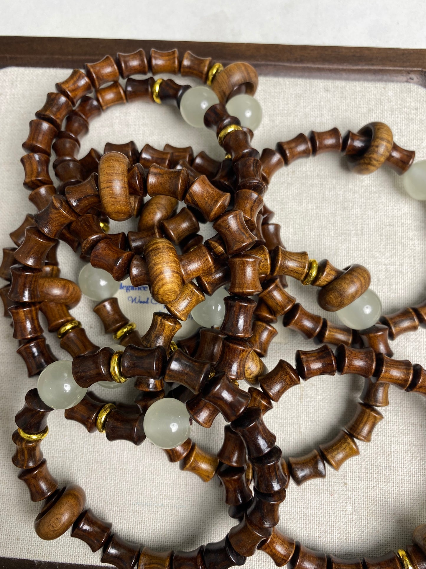 Sandalwood bracelets with glow beads and donut rings