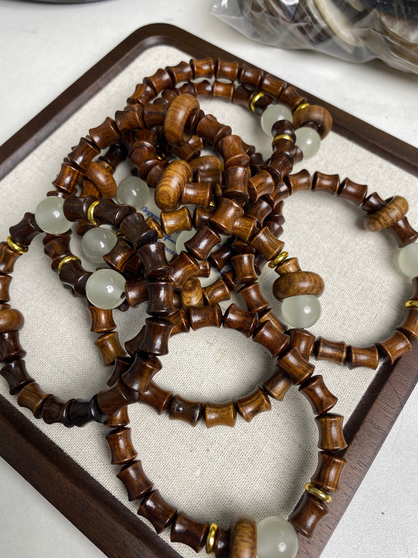 Sandalwood bracelets with glow beads and donut rings